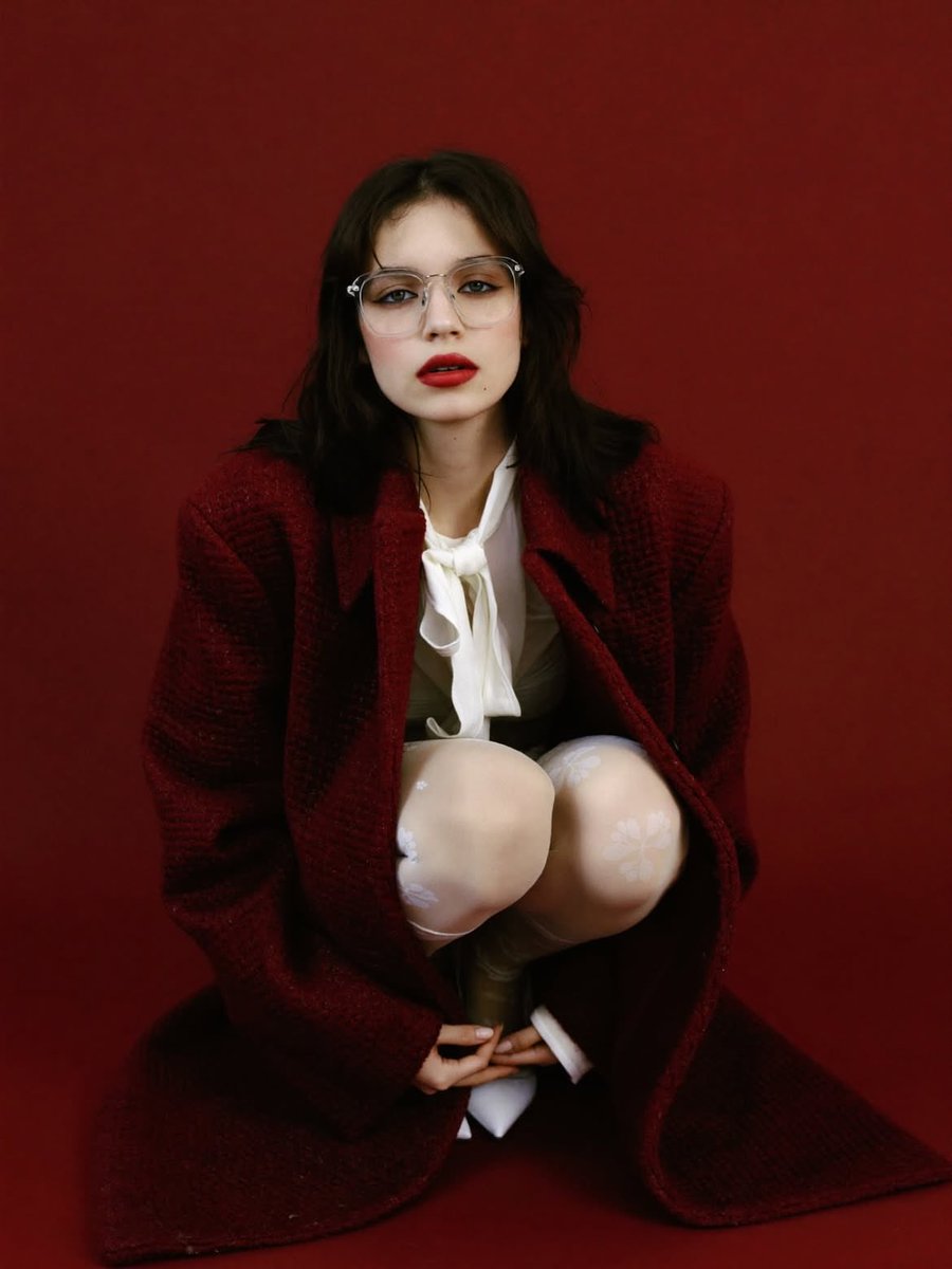 High-Fashion Editorial Portrait with Red Background 2