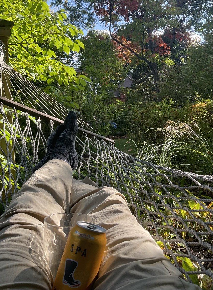 Physicist relaxing in a hammock with SPA drink 1